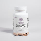White bottle with Enlightened Herbals Logo Cordyceps mushroom capsules sitting in front with one broken open