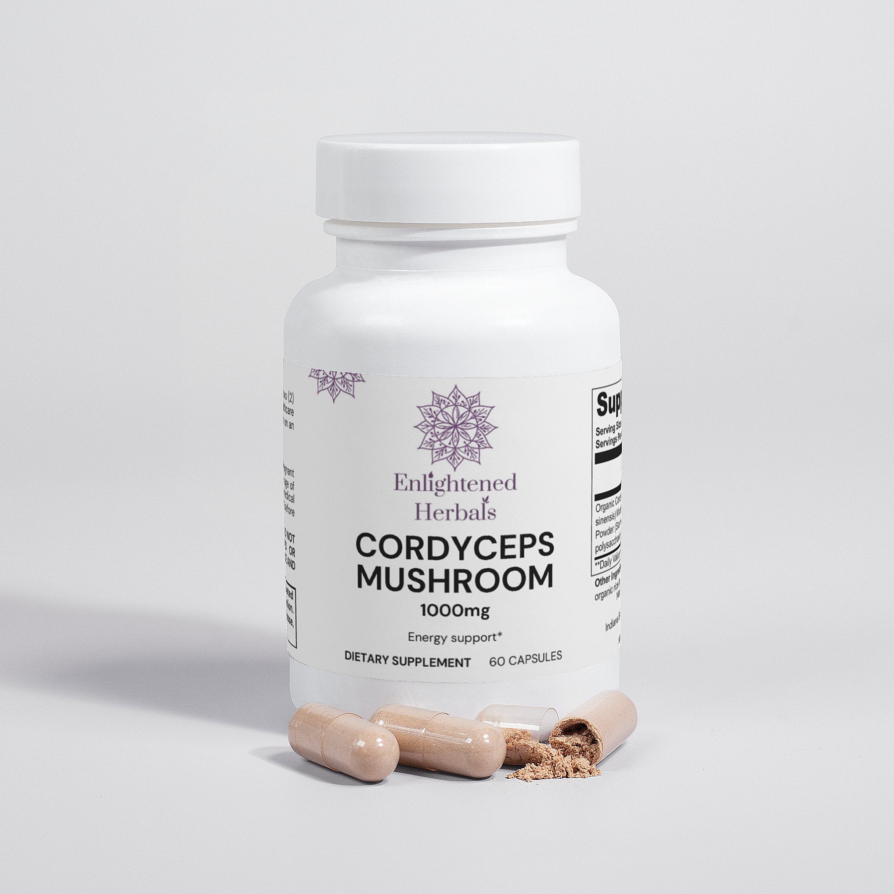 White bottle with Enlightened Herbals Logo Cordyceps mushroom capsules sitting in front with one broken open